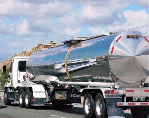 A specialty trailer type, possible hauling liquid in steal enclosed tank