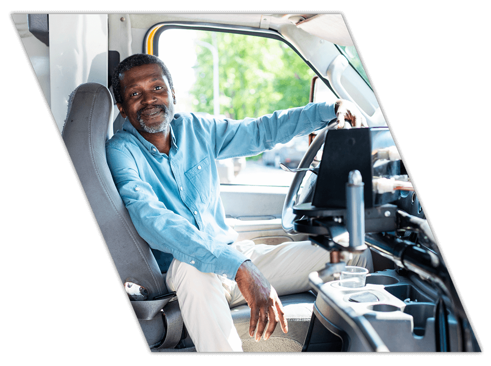 Relaxed truck driver in truck during company CDL training in Tennessee