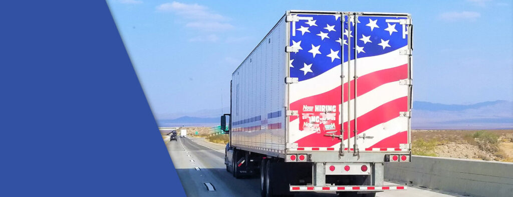 A truck driving on the open road in America.